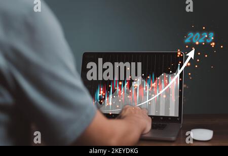 2023 business finance technology and investment concept. Stock Market Investments Funds and Digital Assets. businessman analysing forex trading graph Stock Photo