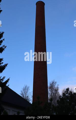 A tall brick chimney Stock Photo