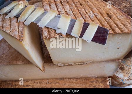 The Ossau-Iraty, a traditional pressed uncooked sheep’s milk cheese, is the pride of the Pays Basque and Béarn regions of France. Stock Photo