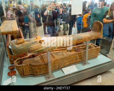 Painted wooden coffin and Egyptian mummy of an unidentified woman from Thebes exhibited in the British Museum, London, UK Stock Photo