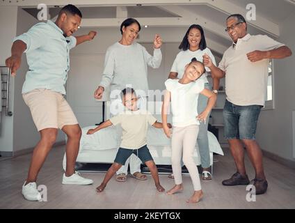 Big family, fun and dance to music in the living room in home, happy and smile together. Children, grandparents or parents dancing, love or crazy Stock Photo