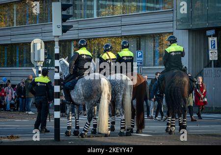 The Hague, The Netherlands, 12.11.2022, Dutch police officers on horses during demonstration in the center of The Hague Stock Photo