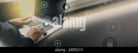 Internet security and data protection concept with man typing on a laptop - blockchain, cybersecurity, information privacy, antivirus virus and intern Stock Photo