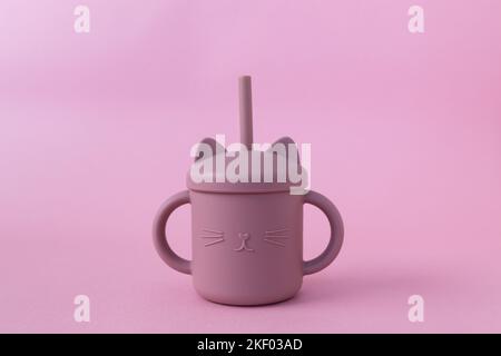 https://l450v.alamy.com/450v/2kf03ad/modern-pastel-color-silicone-sippy-cups-with-straws-on-pink-background-cute-baby-tableware-first-feeding-serving-concept-funny-cup-space-for-text-2kf03ad.jpg