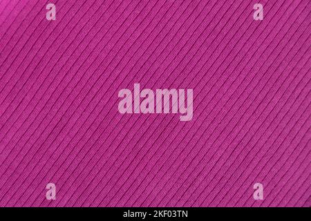 Ribbed cotton fabric texture pink, fuchsia color . Close up rib cotton cloth and textiles pattern. Natural organic fabrics texture background. Stock Photo