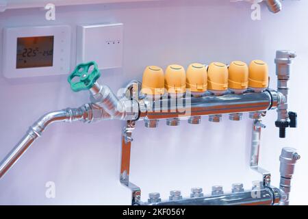 Manifold group for the distribution of the heating medium of the valves. Stock Photo