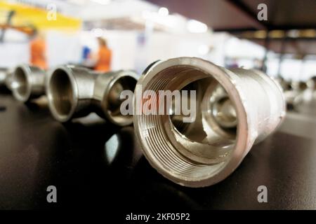 Threaded fittings. Brass nickel-plated fitting. Stock Photo