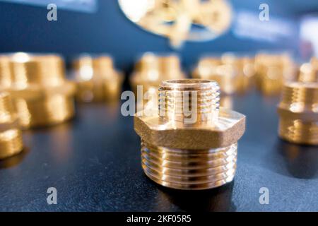 Threaded fittings. Brass nickel-plated fitting. Stock Photo