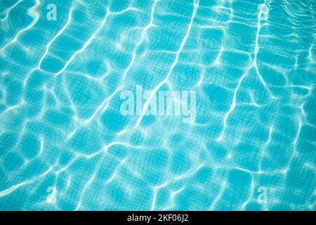 Beautiful relaxing swimming pool water sun reflection background. Ripple water texture background, natural sunlight. Abstract artistic water surface Stock Photo
