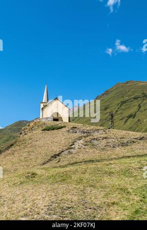 beautiful little catholic church on top of a hill in the mountains in Formazza Valley Stock Photo