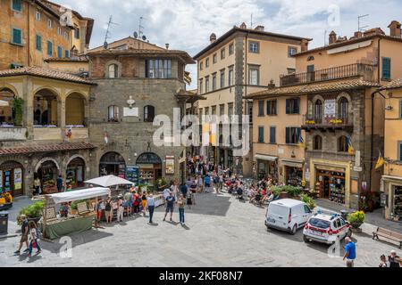 Market stalls in Piazza della Repubblica in hilltop town of Cortona in Tuscany, Italy Stock Photo