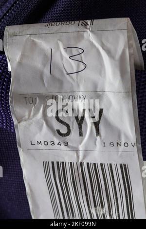 Loganair luggage label stuck on case for SYY Stornoway airport in Scotland Stock Photo