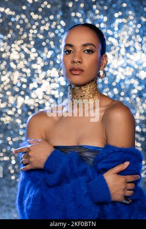 Beautiful young woman with foil on her hair. Bleaching or dyeing