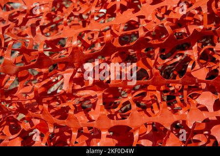 red plastic netting, used on construction sites. close up. Stock Photo