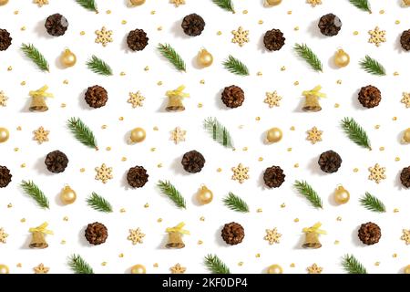 Christmas golden decor seamless pattern on white background. Fir branches, cones, bells and snowflakes. Winter concept. Top view, flat lay. Happy new Stock Photo