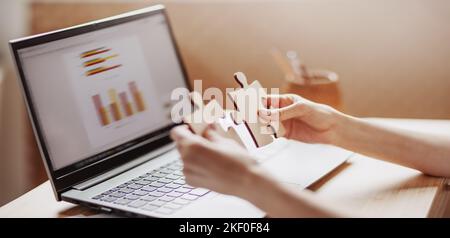 Woman holding pieces of puzzle in the office Stock Photo