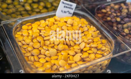 salted Lupin Beans on market in Europe Stock Photo