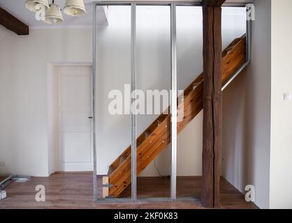 Building a new drywall in to old home living room using metal frame construction and gypsum plasterboard. Home renovation concept. Home living room. Stock Photo