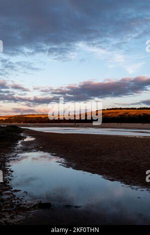 The River Gannel in Newquay at low tide and sunset. Stock Photo
