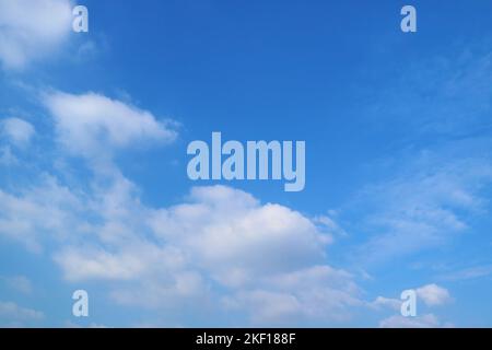 Pure White Clouds Floating on Vibrant Blue Sky Stock Photo