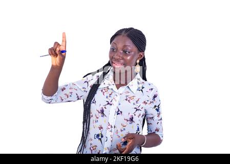 portrait of serious young woman wearing red t-shirt, pointing finger up. Stock Photo