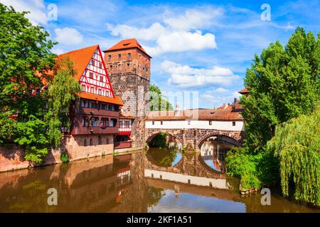 Wasserturm tower, Weinstadel medieval house and Henkerbrucke bridge at Pegnitz river in Nuremberg old town. Nuremberg is the second largest city of Ba Stock Photo