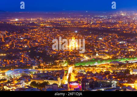 Tbilisi old town aerial panoramic view at night. Tbilisi is the capital and the largest city of Georgia, lying on the banks of the Kura River. Stock Photo