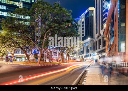 Kigali, Rwanda - August 19 2022: The centre of Kigali at night. The city is a hive of activity in the evenings. Stock Photo