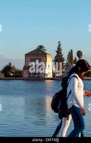 Water reservoir and pavilion of the Menara gardens at Marrakesh Stock Photo