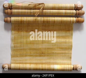 Two papyrus scrolls, one rolled open with space for your own text, one closed Stock Photo