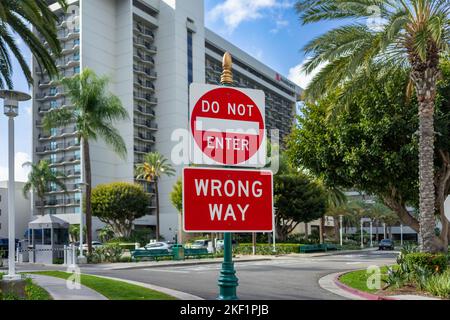 Anaheim, CA, USA – November 1, 2022: A Do Not Enter - Wrong Way street sign posted at the Marriott Hotel at the Convention Center District in Anaheim, Stock Photo