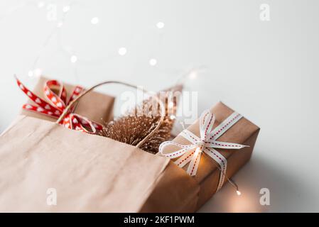 Shopping bag with gift boxes Christmas and New Year sale. Stock Photo