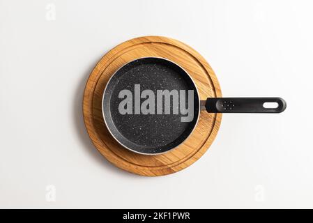 Empty pan on wood board. pan for pancake Stock Photo