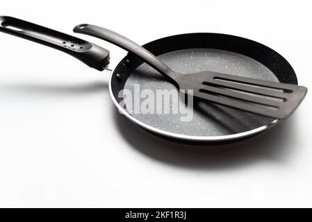 https://l450v.alamy.com/450v/2kf1r3j/empty-pan-and-flipper-used-in-frying-for-cookingkitchenware-2kf1r3j.jpg