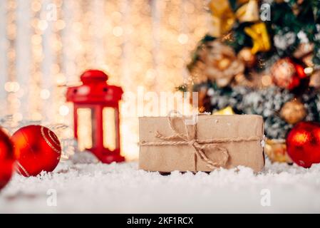 Gift box wrapped on craft paper on Christmas holiday Stock Photo