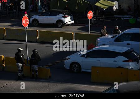 Tijuana, Baja California, Mexico. 15th Nov, 2022. Mexican immigration authorities along with national and municipal officers patrol a new checkpoint to prevent travelers crossing by car without valid documentation (a task currently performed by United States border officials) to prevent asylum seekers from driving into U.S. soil at the San Ysidro Port of Entry from Tijuana to San Diego, California on Tuesday, November 15, 2022. The pilot program started today with both the U.S. and Mexico cooperating in what has seen the nation's role increase even further in helping the control of mig Stock Photo