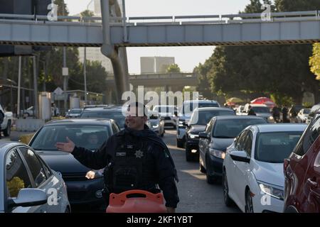 Tijuana, Baja California, Mexico. 15th Nov, 2022. Mexican immigration authorities along with national and municipal officers patrol a new checkpoint to prevent travelers crossing by car without valid documentation (a task currently performed by United States border officials) to prevent asylum seekers from driving into U.S. soil at the San Ysidro Port of Entry from Tijuana to San Diego, California on Tuesday, November 15, 2022. The pilot program started today with both the U.S. and Mexico cooperating in what has seen the nation's role increase even further in helping the control of mig Stock Photo