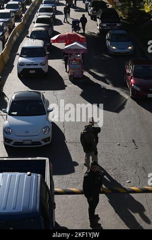 Tijuana, Baja California, Mexico. 15th Nov, 2022. Mexican immigration authorities along with national and municipal officers patrol a new checkpoint to prevent travelers crossing by car without valid documentation (a task currently performed by United States border officials) to prevent asylum seekers from driving into U.S. soil at the San Ysidro Port of Entry from Tijuana to San Diego, California on Tuesday, November 15, 2022. The pilot program started today with both the U.S. and Mexico cooperating in what has seen the nation's role increase even further in helping the control of mig Stock Photo