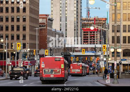 Ottawa, Canada - November 5, 2022: Busy traffic on Rideau street in downtown district. Cityscape with buildings, intersection, traffic lights, buses o Stock Photo