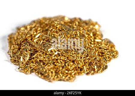 Golden chain links against white background Stock Photo