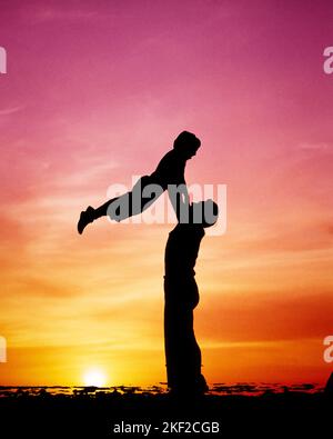 1950s 1960s 1970s ANONYMOUS SILHOUETTED MAN FATHER LIFTING CHILD SON IN AIR ON SHORE AT DUSK - kj5181 LEF001 HARS LIFTING JUVENILE TEAMWORK EMBRACE SONS LIFT FAMILIES JOY LIFESTYLE CELEBRATION FEMALES FLIGHT RURAL GROWNUP HEALTHINESS COPY SPACE FRIENDSHIP FULL-LENGTH PHYSICAL FITNESS DAUGHTERS PERSONS INSPIRATION MALES SERENITY SPIRITUALITY FATHERS SINGLE PARENT FREEDOM SINGLE PARENTS SHORE DREAMS HAPPINESS STRENGTH SILHOUETTED COMPOSITE DADS EXCITEMENT LOW ANGLE RECREATION PRIDE TO SWINGING CONNECTION CONCEPTUAL SUNRISE DUSK SUPPORT ANONYMOUS ELEVATING AFFECTION GROWTH JUVENILES MID-ADULT Stock Photo
