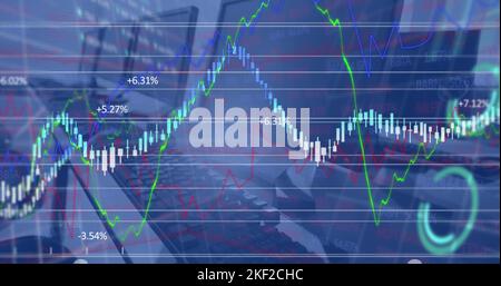 Image of financial data processing against close up of desks at office Stock Photo