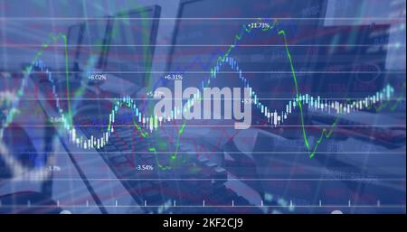 Image of financial data processing against close up of desks at office Stock Photo