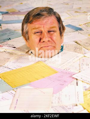 1970s 1980s CRYING MAN BURIED UP TO HIS NECK IN BILLS INVOICES PAPER WORK  - ks14530 HAR001 HARS FACIAL ANGER FEAR PAPERWORK TROUBLE NECK DEBT WORRY PROBLEM LIFESTYLE EXHAUSTED CURRENCY STUDIO SHOT MOODY GROWNUP TEARS HOME LIFE FINANCES COPY SPACE PERSONS GROWN-UP CRY MALES RISK FRIGHTENED DROWNING EXPRESSIONS TROUBLED MIDDLE-AGED CONCERNED FINANCIAL SADNESS SINKING MIDDLE-AGED MAN BURIED OVERWORKED DISASTER WEEPING HEAD AND SHOULDERS HIGH ANGLE HIS THINK BANKRUPTCY BAWLING UP MOOD SOBBING OVERWHELM PONDER PONDERING CONCEPTUAL GLUM FEARFUL FRANTIC BANKRUPT DEBTOR INSOLVENT FAILURE MID-ADULT Stock Photo