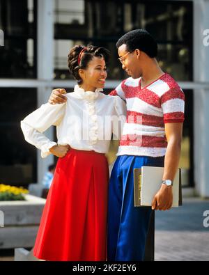 1980s ROMANTIC AFRICAN-AMERICAN COUPLE ON CAMPUS SMILING ARMS EMBRACING LOOKING AT ONE ANOTHER MAN CARRYING NOTEBOOKS BPPKS - ks20867 TEU001 HARS EDUCATION ROMANTIC CLOTHING DATE NOSTALGIC PAIR ROMANCE COMMUNITY SUBURBAN URBAN COLOR RELATIONSHIP OLD TIME FUTURE NOSTALGIA HUGGING OLD FASHION 1 JUVENILE STYLE COMMUNICATION YOUNG ADULT TEAMWORK EMBRACE PLEASED JOY LIFESTYLE CAMPUS FEMALES HEALTHINESS COPY SPACE FRIENDSHIP HALF-LENGTH HUG LADIES PERSONS CARING MALES CONFIDENCE EMBRACING DATING DREAMS HAPPINESS CHEERFUL UNIVERSITIES AFRICAN-AMERICANS AFRICAN-AMERICAN NOTEBOOKS BLACK ETHNICITY PRIDE Stock Photo