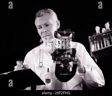 Chemist working in industrial laboratory clean room Stock Photo - Alamy