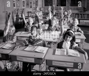 1960s ELEMENTARY SCHOOL CLASSROOM CAUCASIAN TEACHER AND AFRICAN ...