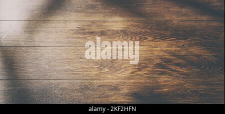Light from the window on the wooden wall inside the building. A Game of shadows and color from the falling rays of the sun on a wood boards Stock Photo