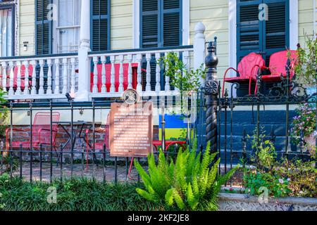 NEW ORLEANS, LA, USA  - NOVEMBER 10, 2022: Historic marker and front porch of the home of jazz cornetist John 'Johnny' Dedroit on Henry Clay Avenue Stock Photo