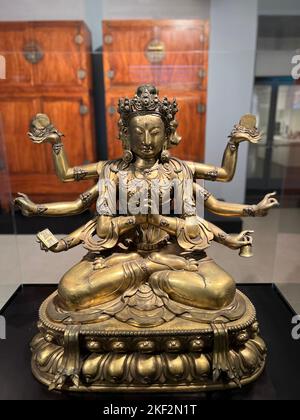 Marichi, Goddes of Dawn; China, Qing Dynasty, 18th century, gilt bronze.  As the Buddhist goddess of dawn, Marichi represents the light of truth breaking through the darkness of ignorance. Stock Photo